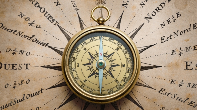 Shutterstock_Triff_Magnetic old compass on map